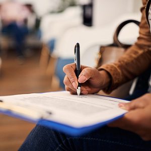 Patient filling out forms in lobby