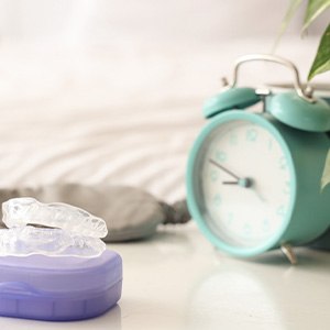 Wear a bite guard or sports guard to protect your dental implants from injury or excessive wear