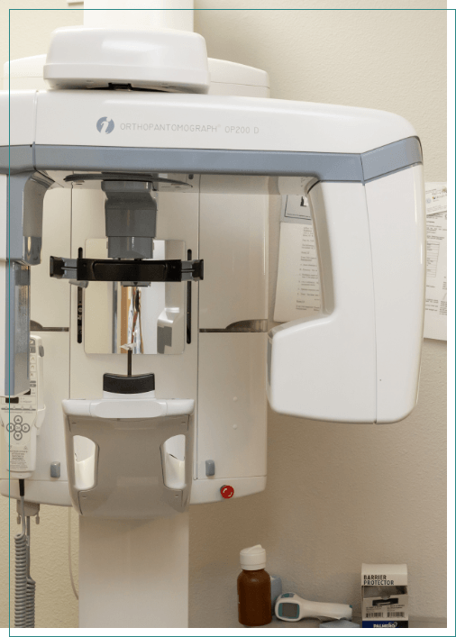 Cone beam scanner against white wall of dental office