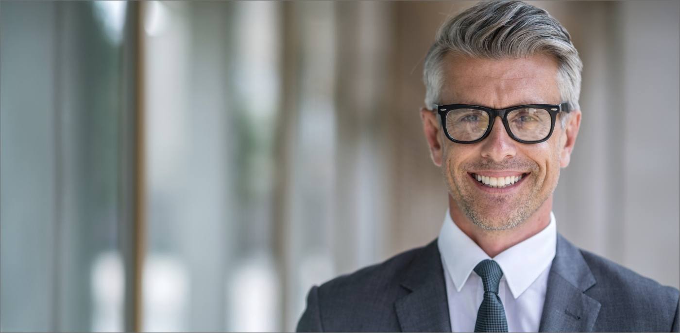 Businessman smiling with CEREC same dental crowns in Boise