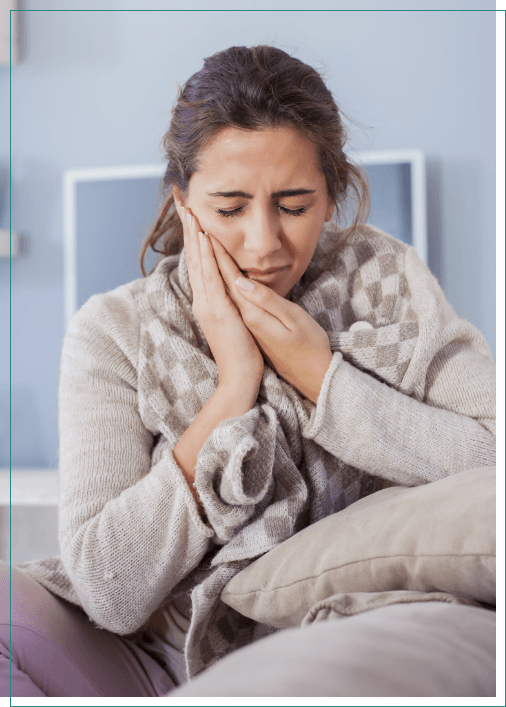 Woman with mouth pain needing emergency dentist in Boise