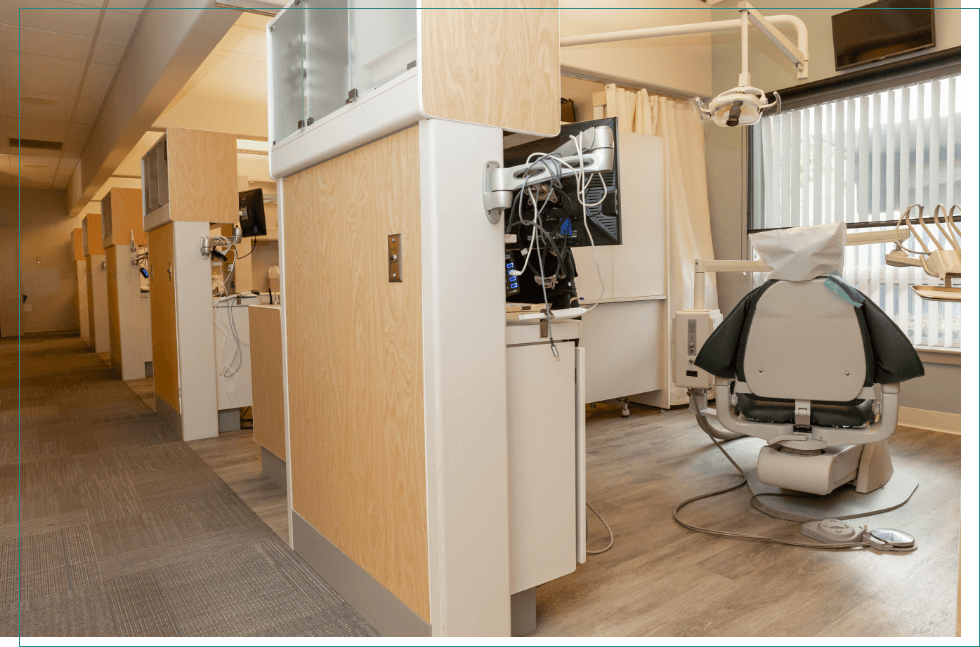 Hallway branching off into several dental treatment rooms