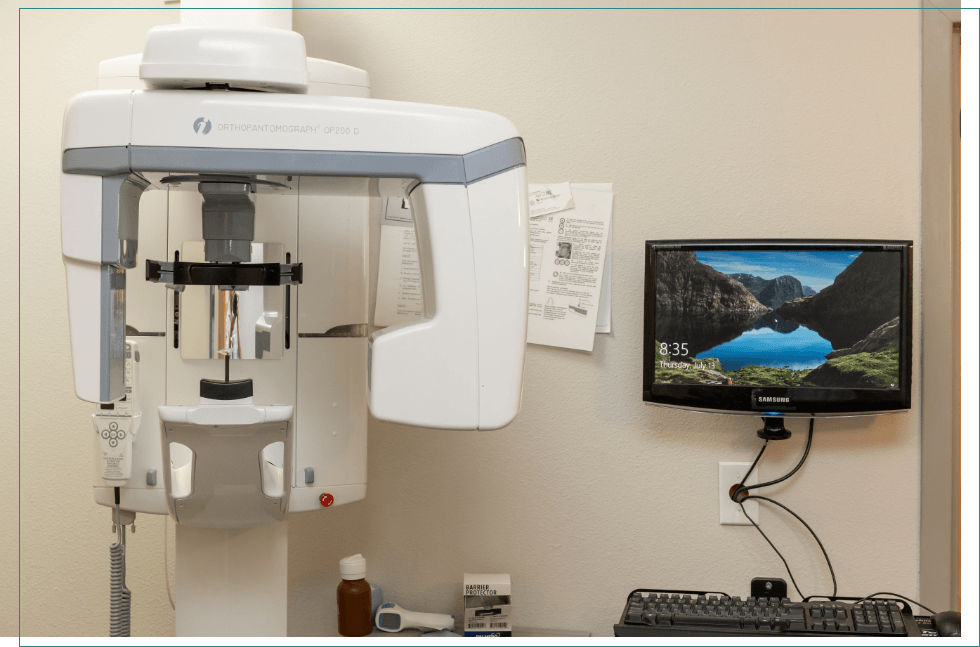 Dental scanning machine next to computer monitor