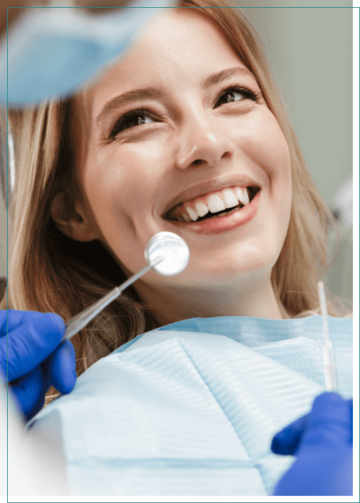 Woman smiling at her dentist during a preventive dentistry checkup