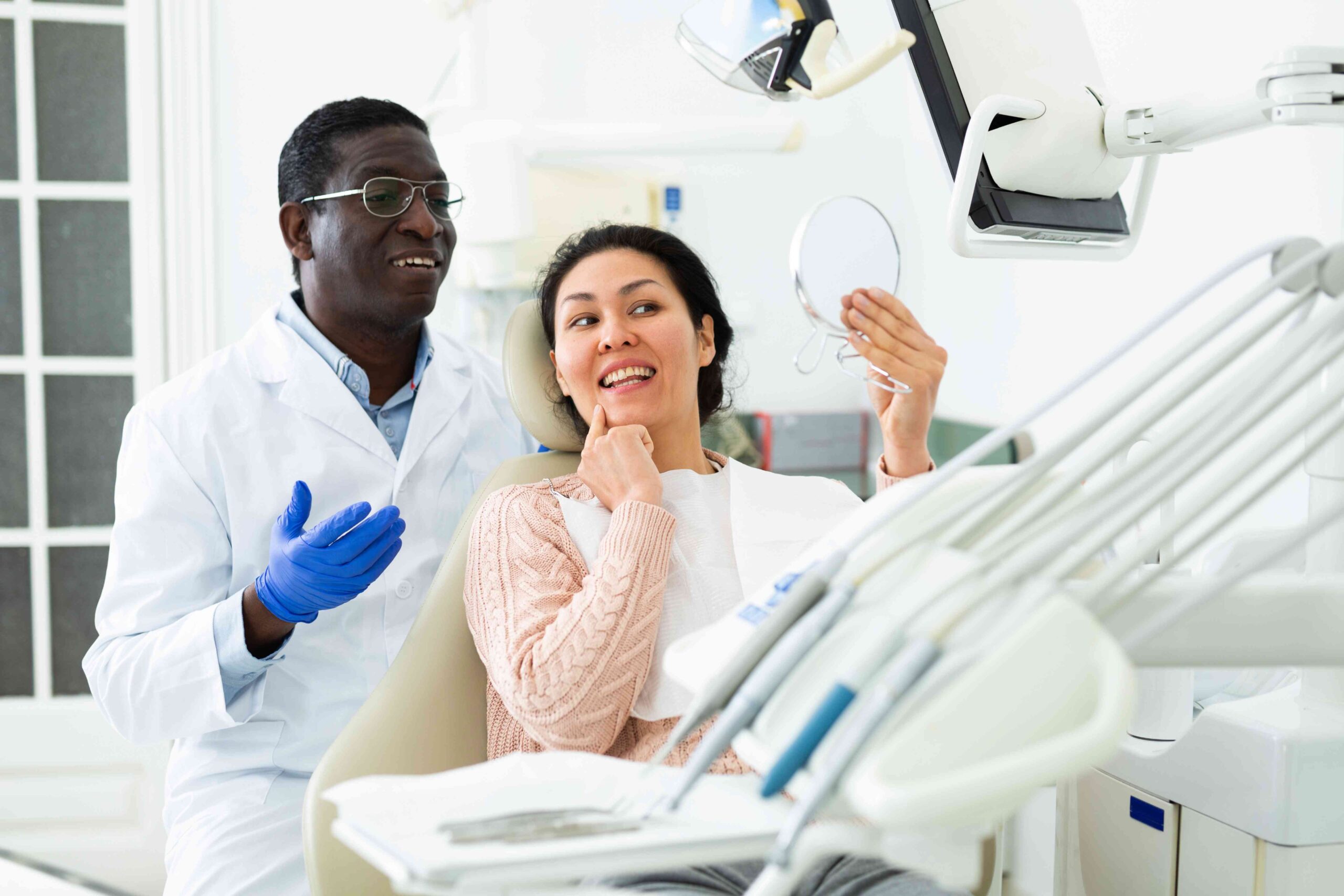 Woman smiling in the dental chair.