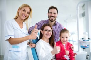Family smiling at the dentist